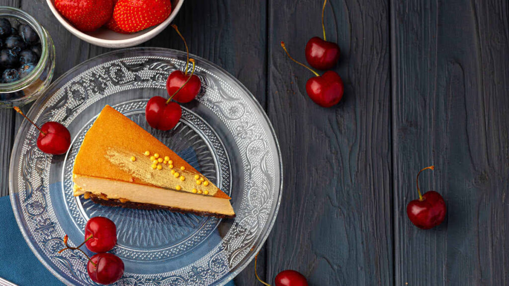 Cheesecake on a plate with cheeries
